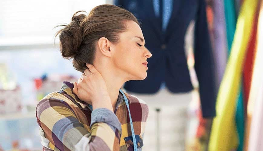 Women Holding Neck Due To Neck Pain