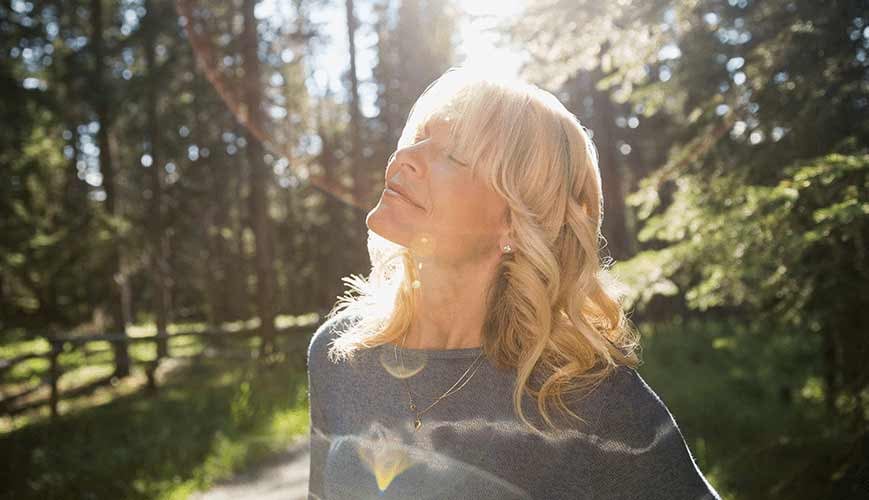 Woman Taking Deep Breath to Release Stress
