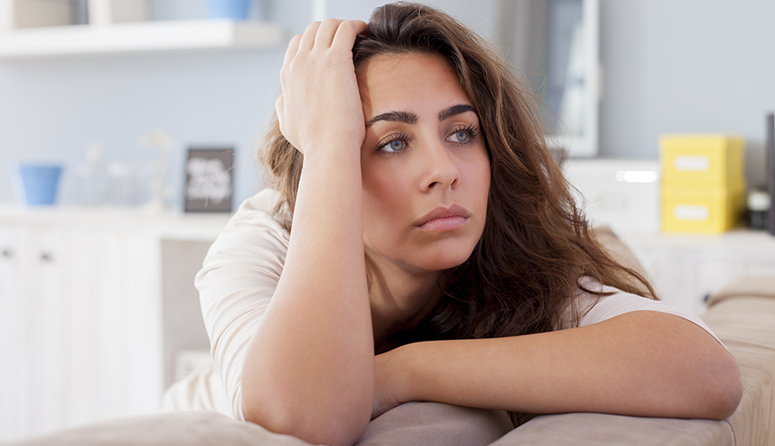Woman experiencing burnout symptoms, feeling mentally exhausted and overwhelmed.